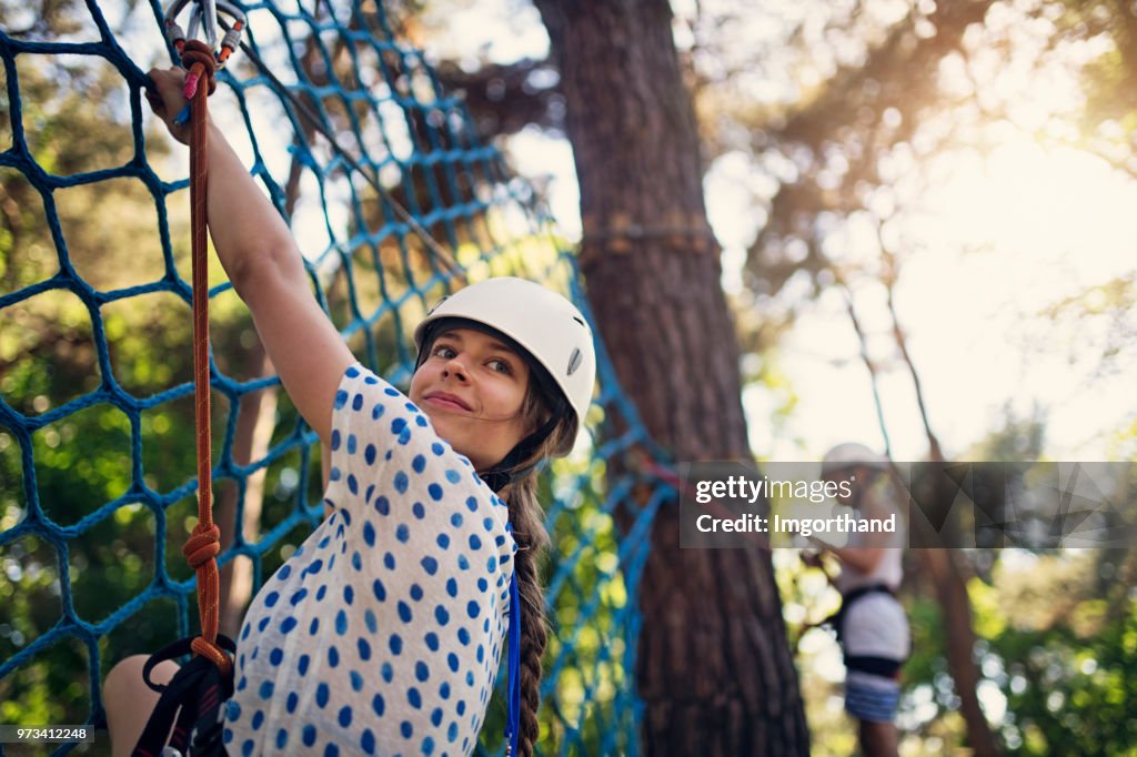 Kids having fun during in ropes course  adventure park