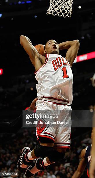Derrick Rose of the Chicago Bulls goes up for a dunk against the Atlanta Hawks at the United Center on March 1, 2010 in Chicago, Illinois. The Hawks...