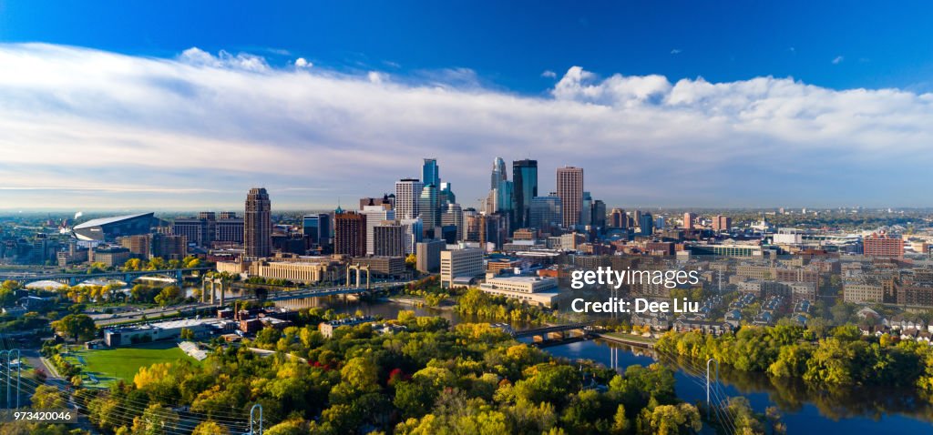 Minneapolis Skyline Aerial With River And Golden Trees During Autumn
