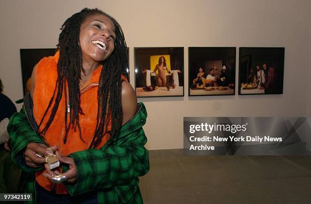 Photographer Renee Cox stands in front of her five-panel color photo titled "Yo Mama's Last Supper" that depicts Christ as a nude woman. The work, on...