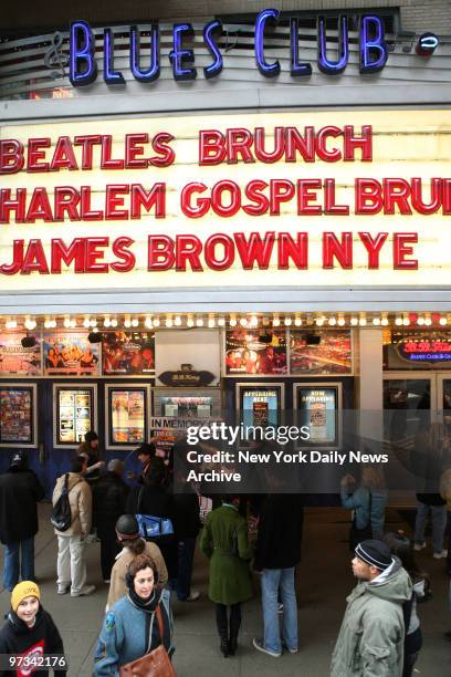 People pay their respects at a makeshift memorial for soul singer James Brown outside B.B. King's Blues Club on W. 42nd St. The "Godfather of Soul"...