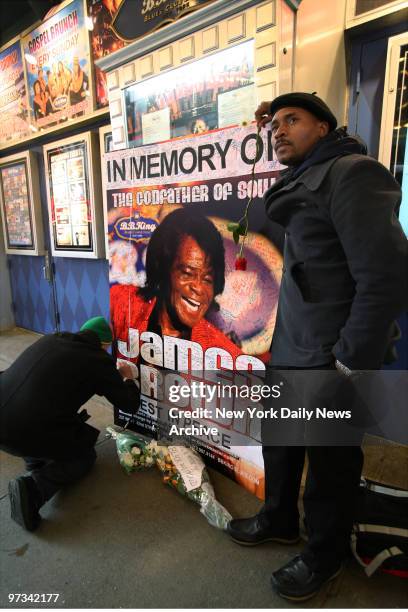 People pay their respects at a makeshift memorial for soul singer James Brown outside B.B. King's Blues Club on W. 42nd St. The "Godfather of Soul"...