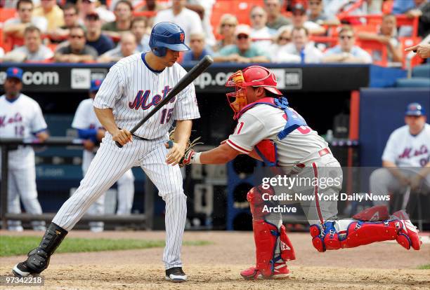 Philadelphia Phillies' catcher Carlos Ruiz tags New York Mets' Carlos Beltran, who strikes out with a check swing to end the game at Shea Stadium....