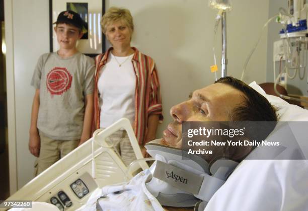 Paul Robinson of Kirkland, WA, photographed with his wife Kathy, and son John, after surgery for a fracture of the C2 vertebra at Montefiore Medical...