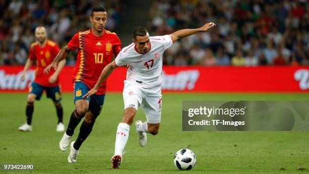 Thiago Alcantara of Spain and Ellyes Skhiri of Tunisia battle for the ball during the friendly match between Spain and Tunisia at Krasnodar's stadium...