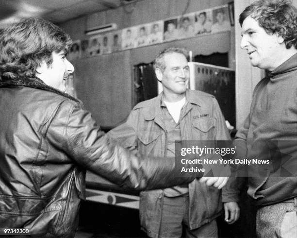 Paul Newman and Danny Aiello greet bar patron after filming "Fort Apache: The Bronx"