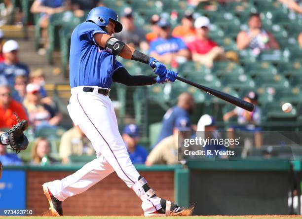 Nomar Mazara of the Texas Rangers hits a stand up double in the eighth inning against the Houston Astros at Globe Life Park in Arlington on June 10,...