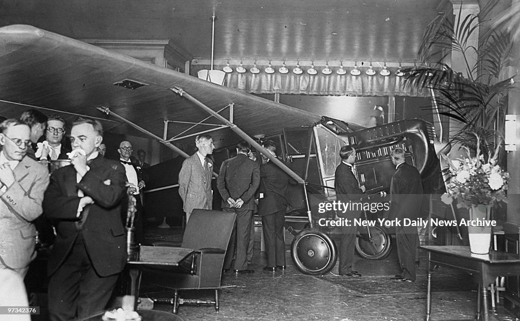 People look at new (Glenn H.) Curtiss-Robin plane in showroo