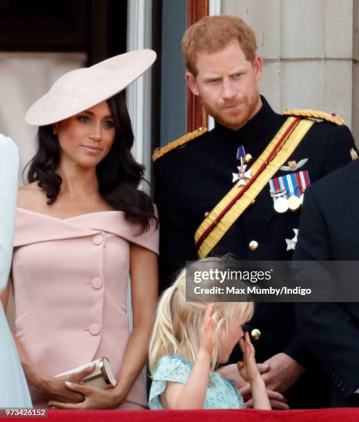 Meghan, Duchess of Sussex, Prince Harry, Duke of Sussex and Isla Phillips stand on the balcony of Buckingham Palace during Trooping The Colour 2018...