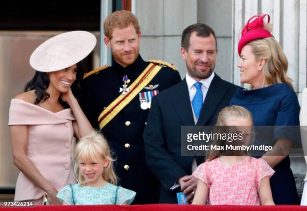 Meghan, Duchess of Sussex, Prince Harry, Duke of Sussex, Isla Phillips, Peter Phillips, Savannah Phillips and Autumn Phillips stand on the balcony of...