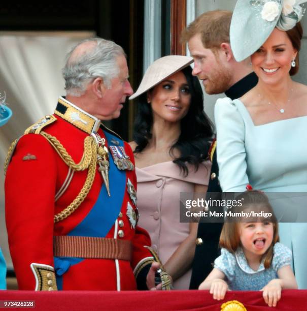Prince Charles, Prince of Wales, Meghan, Duchess of Sussex and Prince Harry, Duke of Sussex stand on the balcony of Buckingham Palace during Trooping...