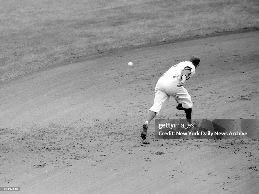 Pee Wee Reese lunges as Phil Rizzuto's liner gets past him f