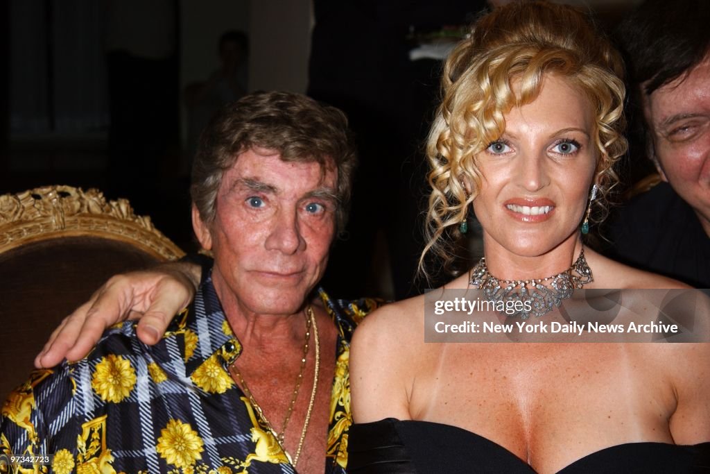 Penthouse publisher Bob Guccione and fiance April Warren at party