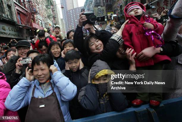 People celebrate the Chinese Lunar New Year on Mott St. In Chinatown. This year, 4702 on the Chinese calendar, is the year of the Rooster.