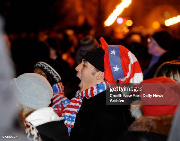 People come out early to celebrate President Barack Obama's Inauguration day along the Parade Route along Pennsylvania Avenue in Washington DC