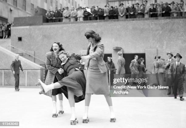 People skating at the opening of the Rockefeller Center roller skating rink.