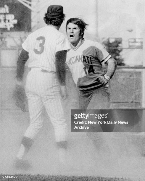 Pete Rose of the Cincinnati Reds starts fight with Bud Harrelson of the New York Mets during a National League playoff game at Shea Stadium.