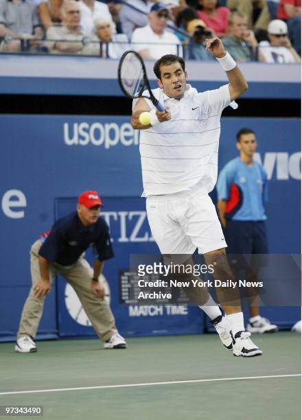 Pete Sampras goes airborne as he hits a return to Andre Agassi during their finals match of the U.S. Open at Arthur Ashe Stadium in Flushing...