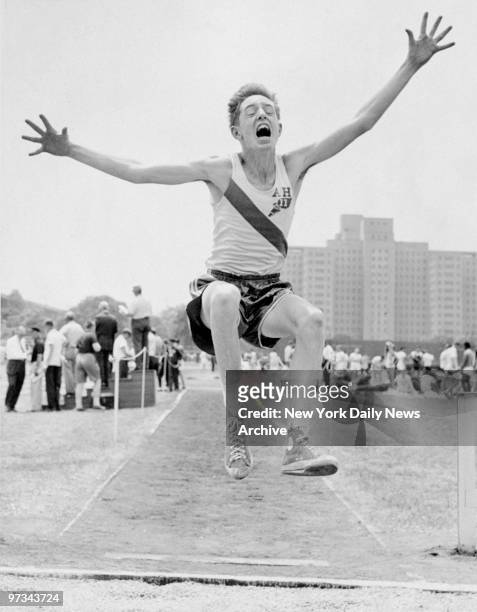 Phil Meehan of All Hallows wins the midget broad jump with a 17' 11-1/8" leap at the Catholic High School Athletic Association Championships on...