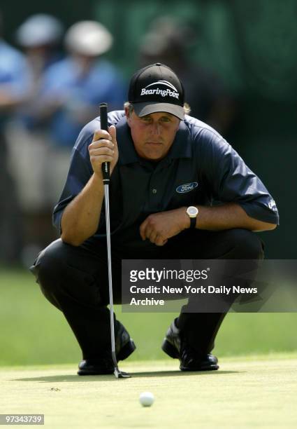 Phil Mickelson of the U.S. Lines up a shot on the third green during the third day of the U.S. Open golf championship at Winged Foot Golf Club in...