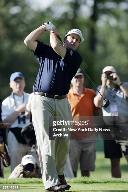 Phil Mickelson watches his shot on the fourth tee during a U.S. Open practice round at Winged Foot Golf Club in Mamaroneck, N.Y.