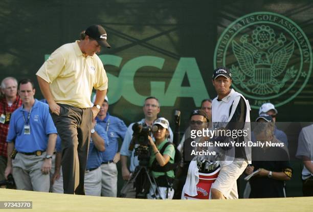 Phil Mickleson of the United States looks at the ground after missing a bogey shot to tie on the 18th hole during the 2006 U.S. Open Championship at...