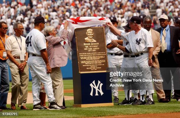 Phil Rizzuto. Whitey Ford and Yogi Berra unveil plaque to honor Reggie Jackson before 56th Old Timers Day at Yankee Stadium.