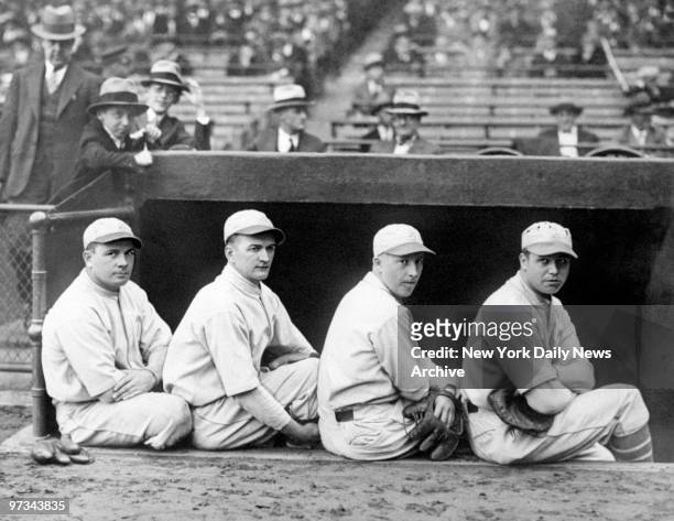 Philadelphia Athletics' third baseman Jimmy Dykes, shortstop Joe Boley, second baseman Max Bishop and first baseman Jimmie Foxx sitt on the dugout...