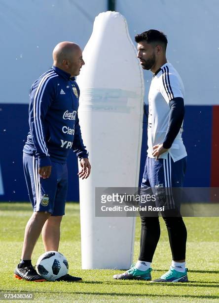 Jorge Sampaoli coach of Argentina talks to Sergio Aguero of Argentina talk during an open to public training session at Bronnitsy Training Camp on...