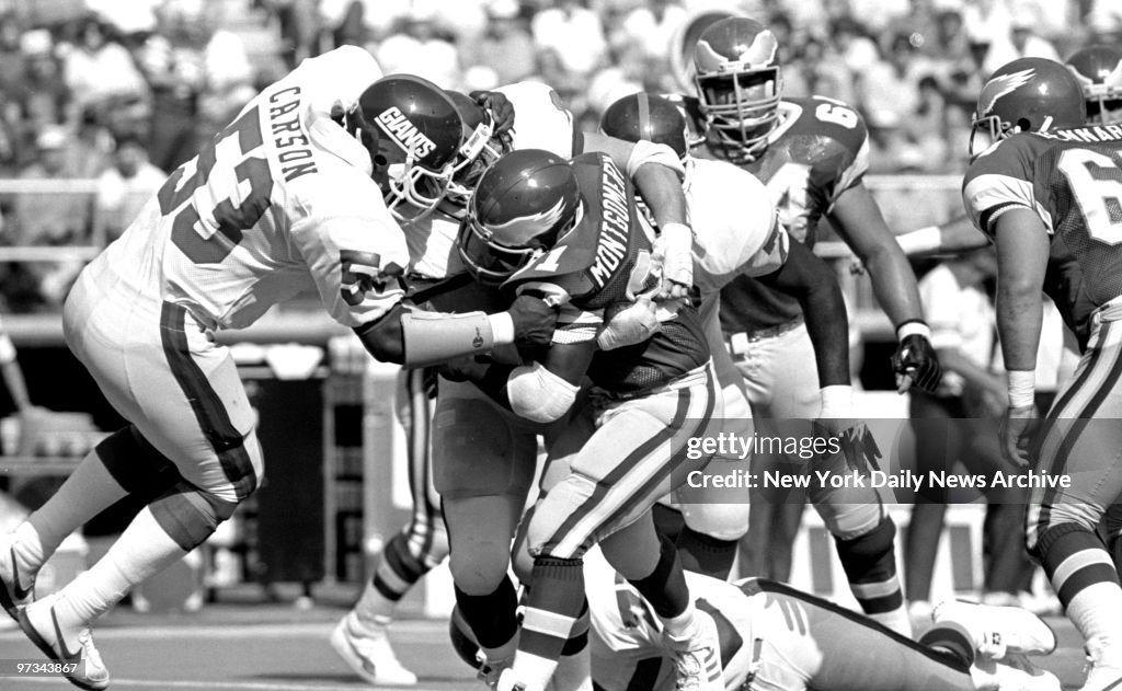 Philadelphia Eagles' Wilbert Montgomery (31) is stopped by N