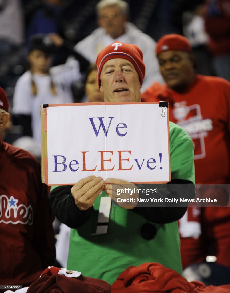 Philadelphia Phillies fan with signs showing that Cliff Lee