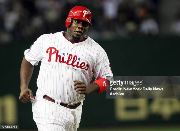 Philadelphia Phillies' Ryan Howard rounds third on Minnesota Twins' Joe Mauer's two-run homer in the fifth inning of Game 2 of the 2006 Japan...