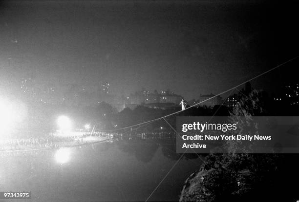 Philippe Petit goes on what amounts to one of the safest walks ever taken at night in Central Park as he negotiates a 600-foot-long cable strung over...