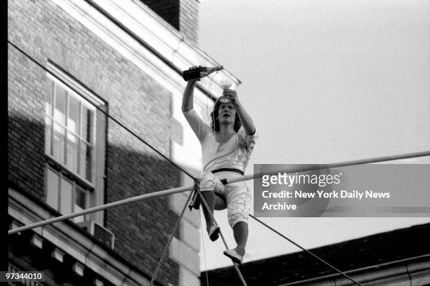 Philippe Petit, who trod a spidery cable 1,350 feet above the ground beteen the towers of the World Trade Center in 1974, quaffed a glass of bubbly...