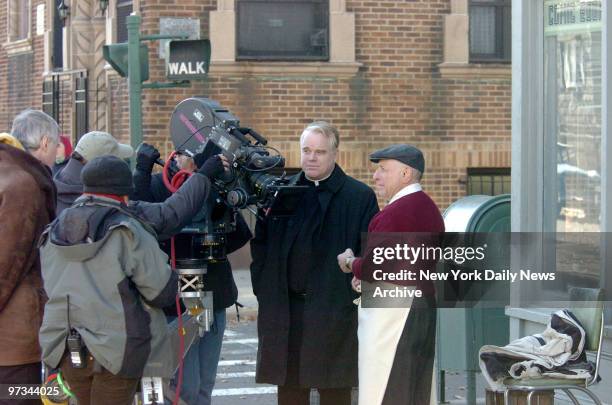 Phillip Seymour Hoffman at the filming of the movie "Doubt" on St Lawrence Ave in the Bronx and the director -screenwriter John Patrick Shanley...