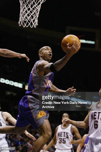 Phoenix Suns' Stephon Marbury goes up for a basket during a game against the New Jersey Nets at Continental Airlines Arena. The Nets went on to beat...