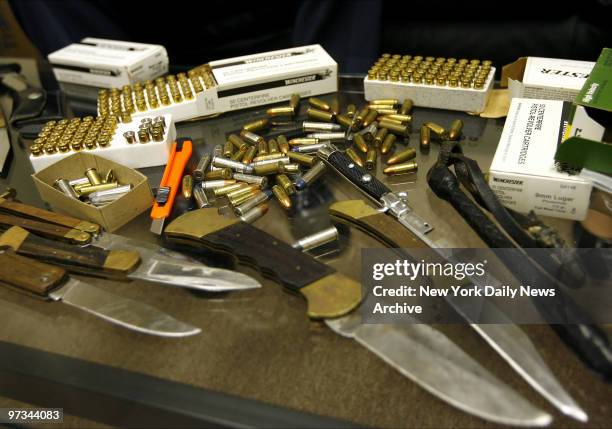 Photo taken of ammunition and knives found in the night table of Raymond Sheehan. Barbara Sheehan, fatally shot Raymond because of the abusive...