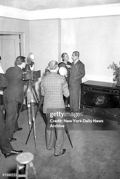 Photographers photographing George Jessel and Norma Talmadge.