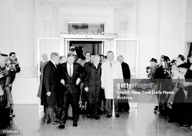 Photographers stand back as President John F. Kennedy, astronaut Lt. Col. John Glenn, and Vice President Johnson leave White House for motor parade...