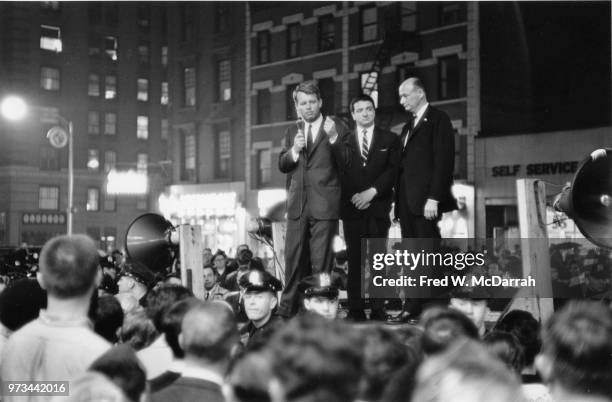 From the back of a flatbed truck, American politician former US Attorney General Robert F Kennedy campaigns for the US Senate to crowd at the...