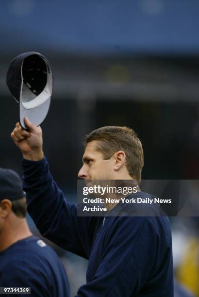 Pitcher Kevin Brown tips his hat to the crowd after he racked up his 200th career victory as the New York Yankees beat the Tampa Bay Devil Rays, 5-1,...