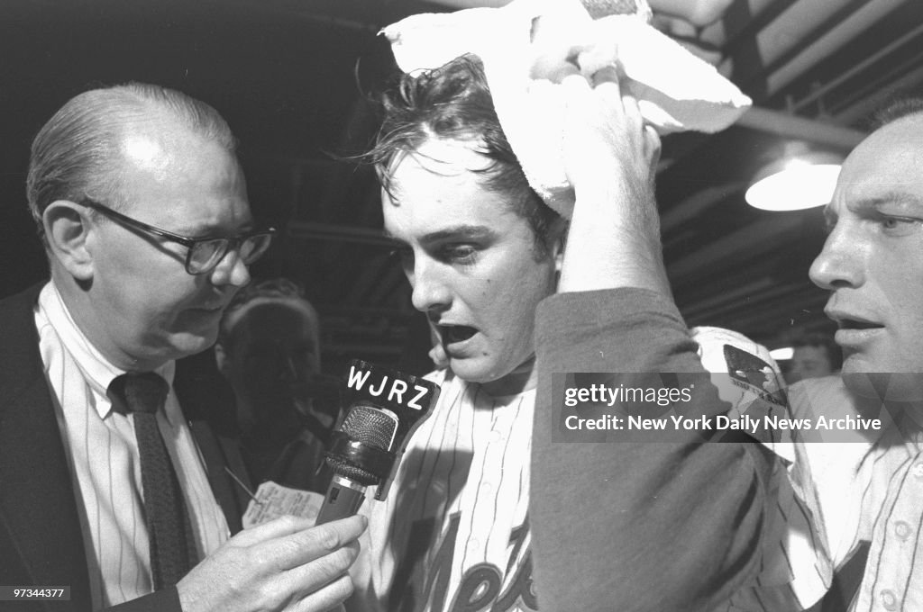 Pitcher Nolan Ryan, who won in relief, sops up champagne and