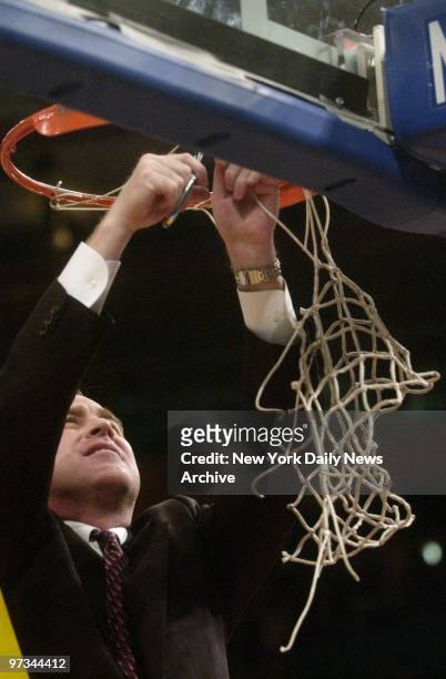 Pittsburgh Panthers' head coach Ben Howland cuts down the net after his team defeated the University of Connecticut Huskies, 74-56, in the Big East...