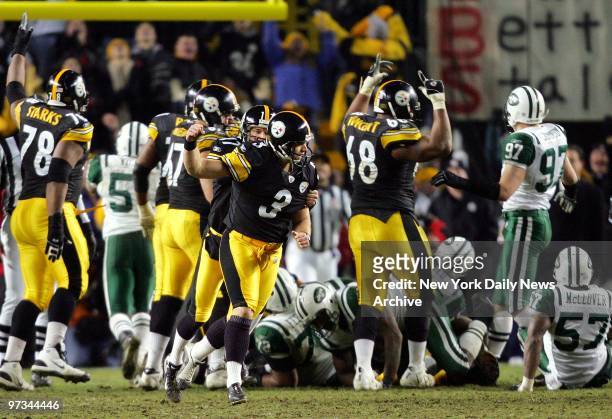 Pittsburgh Steelers' kicker Jeff Reed celebrates with teammates after kicking the game-winning field goal in overtime to defeat the New York Jets,...