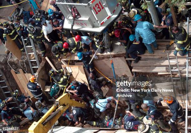 Police and firefighters work to free two construction workers after a wall collapsed at a construction site on 11th St. In Gowanus. Manuel Vergara...