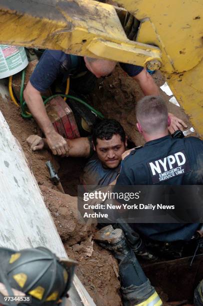 Police and firefighters work to free two construction workers after a wall collapsed at a construction site on 11th St. In Gowanus. Manuel Vergara...