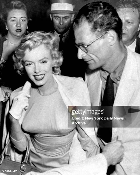 Playwright Arthur Miller and Marilyn Monroe at Idlewild Airport.