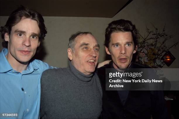 Playwright Lanford Wilson is flanked by Robert Sean Leonard and actor Ethan Hawke at the opening night party for the play "Fifth of July" at the West...