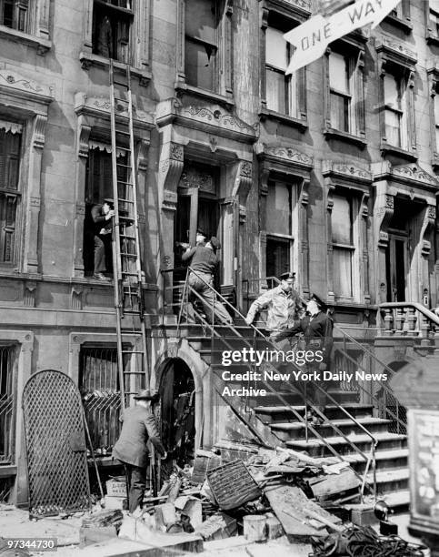 Police attempting to enter the residence of the Collyer brothers, Homer and Langley, at 128th St. And Fifth Avenue. The body of Homer Collyer was...