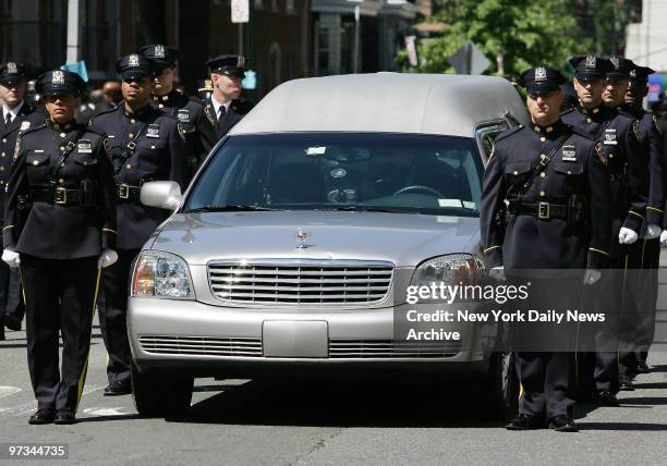 Police bear the coffin of their fallen comrade, NYPD Officer Eric Concepcion, during funeral services at St. Brendan's Church on E. 206th St. In the...